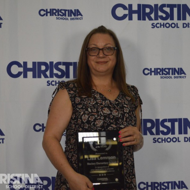 Photo of Lisa Lemmon Teacher of the Year Maclary ES with award